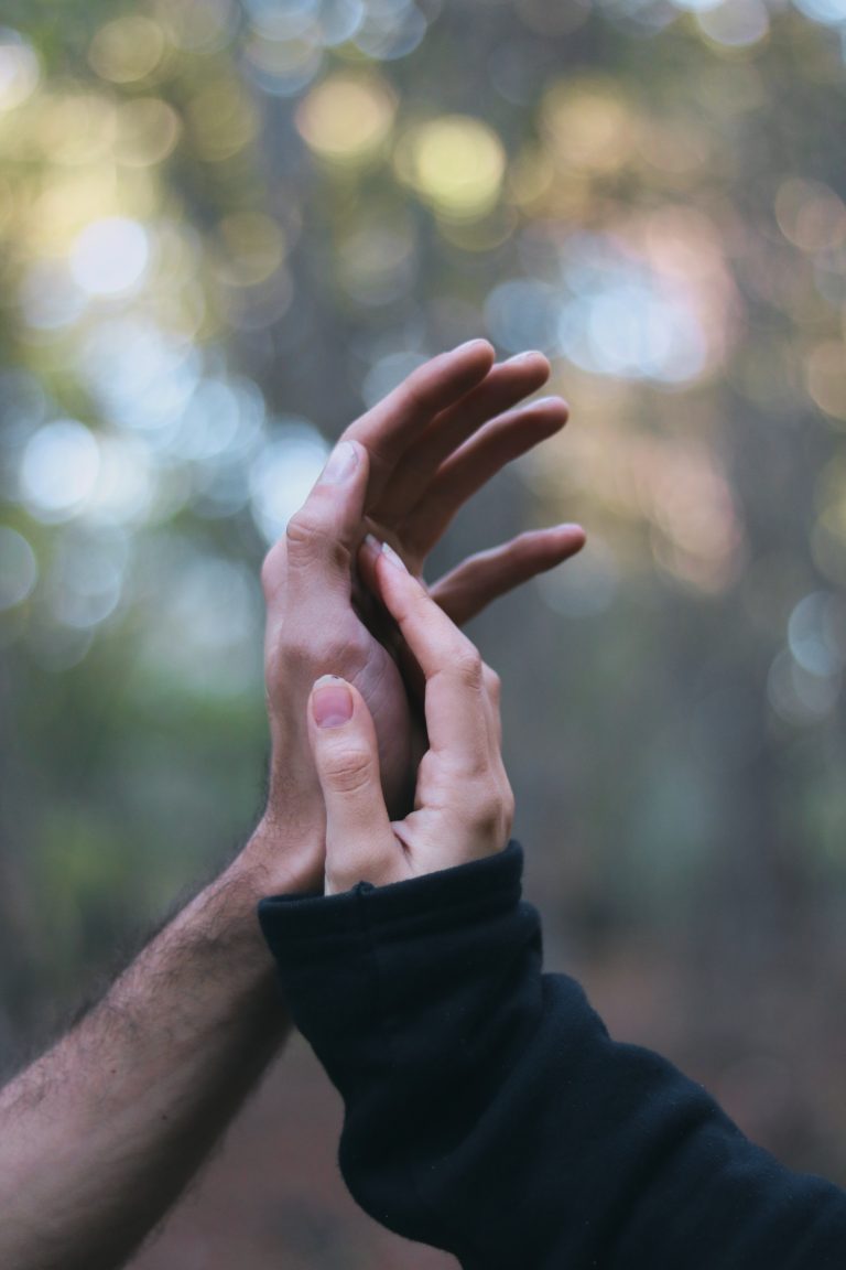 Close up image of a couple holding hands